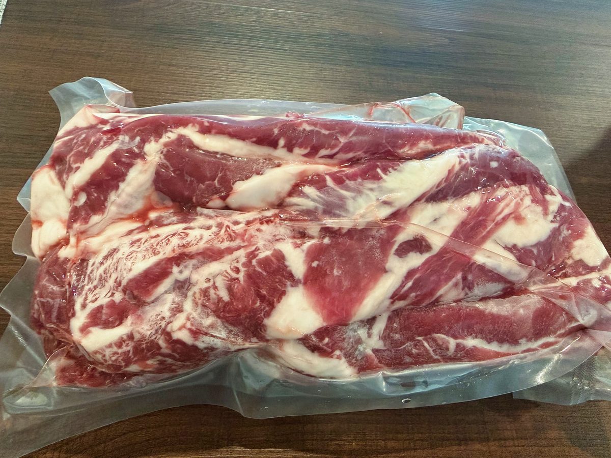 Vacuum-packed beef rib fingers (intercostal meat) on a table